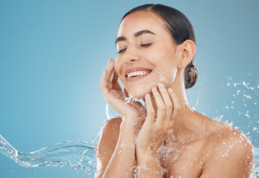Woman washing face with water hydration